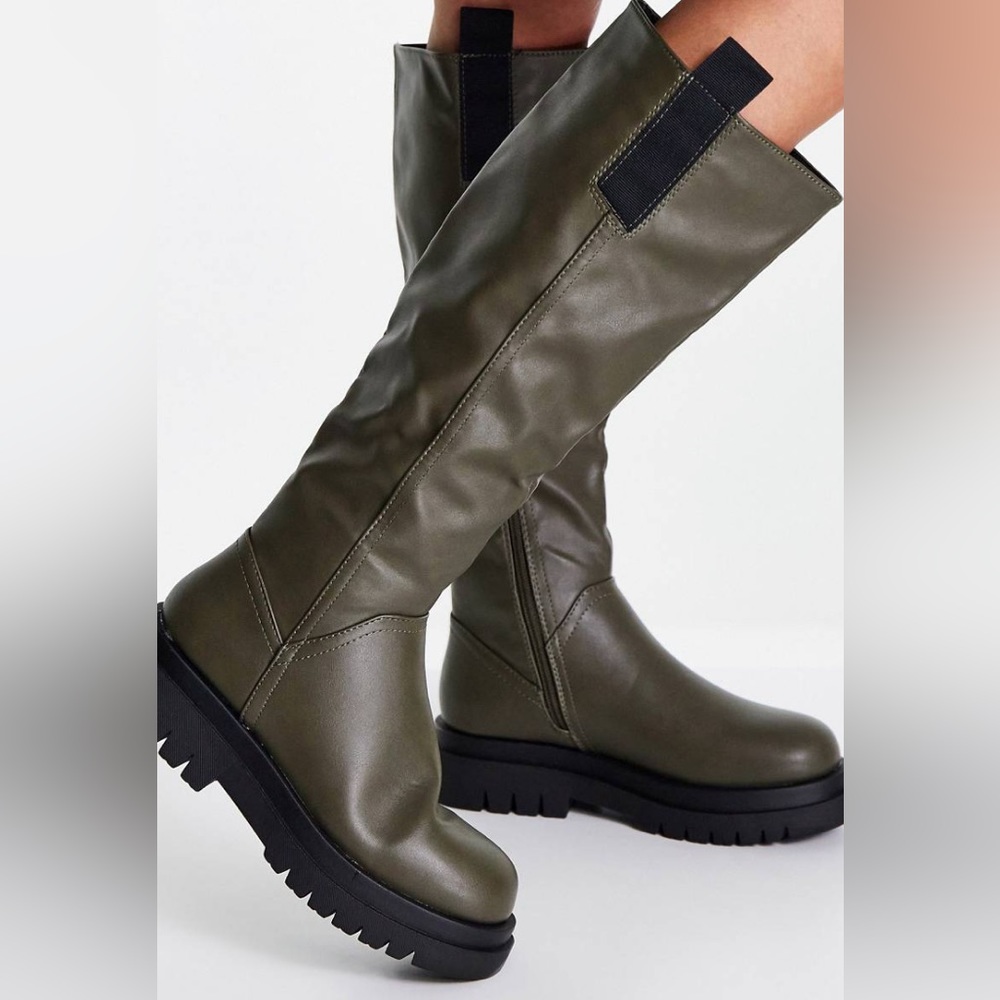 Chunky green knee high boots. Only tried on a couple of times inside the house.